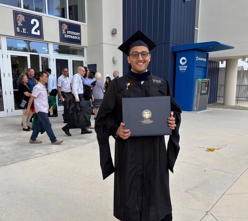 Mina during his Master’s graduation ceremony at Florida International University